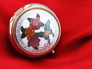 Antique medicine box with butterfly and floral decoration